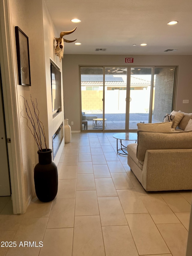 11074 W Tonto St, Avondale, AZ 85323 - living room with baseboards, recessed lighting, light tile patterned flooring, and visible vents