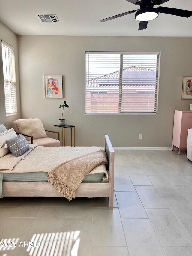 11074 W Tonto St, Avondale, AZ 85323 - bedroom featuring light tile patterned floors, ceiling fan, and visible vents