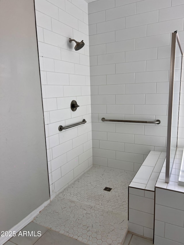 11074 W Tonto St, Avondale, AZ 85323 - bathroom with baseboards and a tile shower