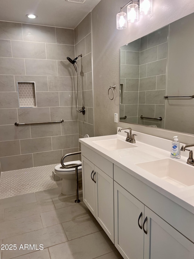 11074 W Tonto St, Avondale, AZ 85323 - bathroom with double vanity, a sink, toilet, and tiled shower