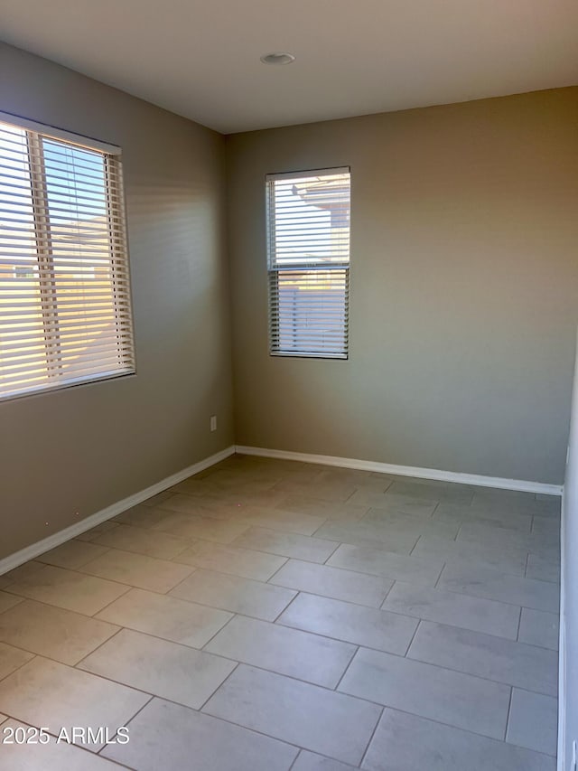 11074 W Tonto St, Avondale, AZ 85323 - unfurnished room with baseboards and light tile patterned floors