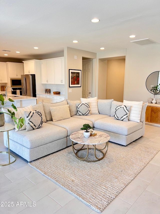11074 W Tonto St, Avondale, AZ 85323 - living area featuring recessed lighting, light tile patterned flooring, and visible vents