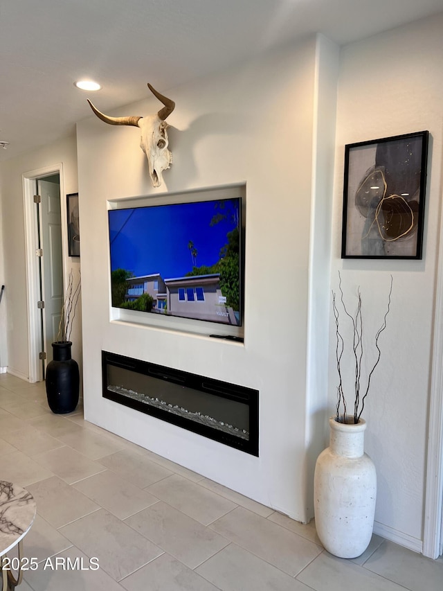 11074 W Tonto St, Avondale, AZ 85323 - living room with recessed lighting, tile patterned floors, and a glass covered fireplace
