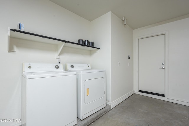 laundry area featuring washing machine and clothes dryer