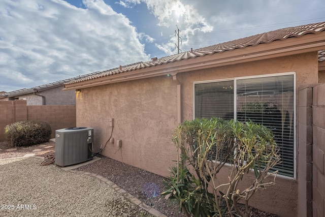 view of home's exterior featuring central AC unit