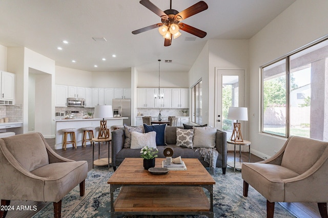 living room featuring dark hardwood / wood-style floors and ceiling fan