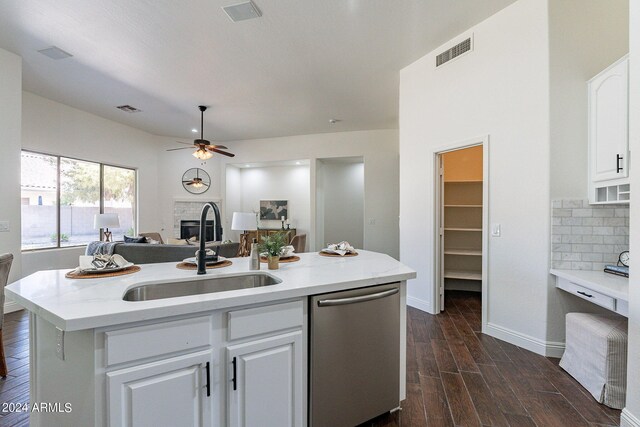 kitchen with dishwasher, sink, white cabinets, a center island with sink, and dark hardwood / wood-style flooring