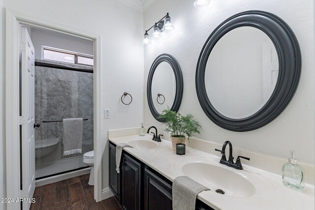 bathroom featuring ornamental molding, vanity, toilet, and hardwood / wood-style flooring