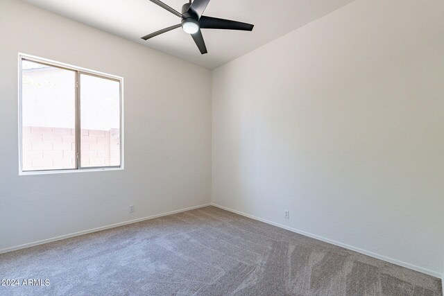 empty room featuring ceiling fan and carpet floors