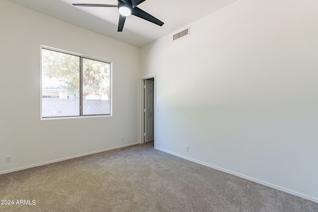 unfurnished room with light carpet and ceiling fan