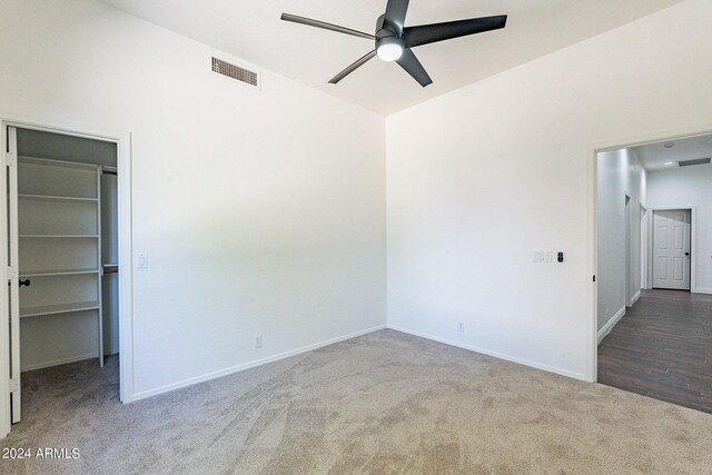 empty room featuring ceiling fan and hardwood / wood-style floors