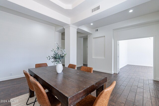 dining space featuring dark wood-type flooring