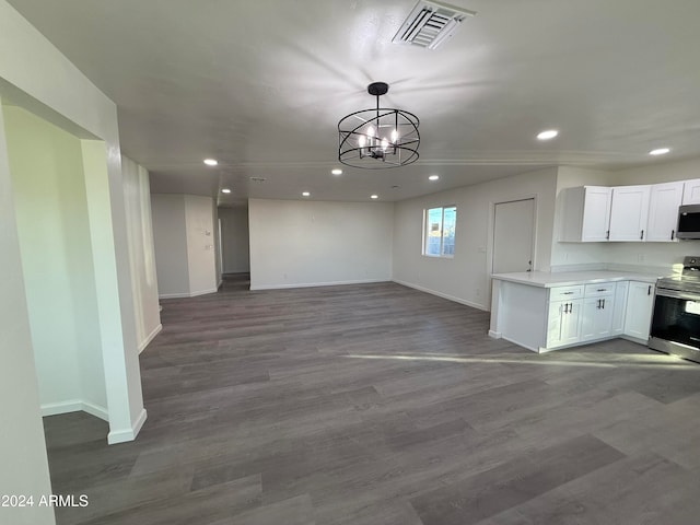 kitchen featuring light hardwood / wood-style floors, white cabinetry, appliances with stainless steel finishes, decorative light fixtures, and a chandelier