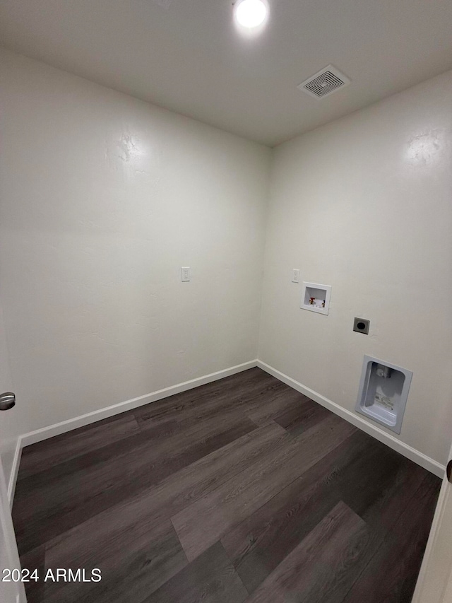 laundry area featuring hookup for a washing machine, dark hardwood / wood-style floors, and hookup for an electric dryer