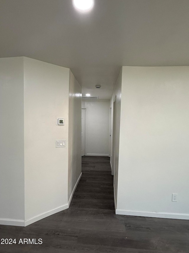 corridor featuring dark hardwood / wood-style floors