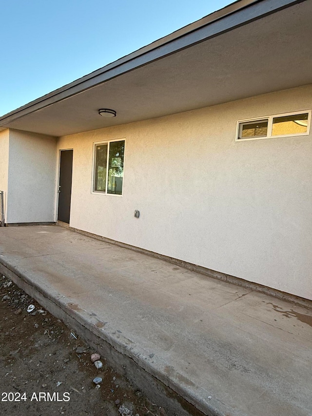 doorway to property featuring a patio