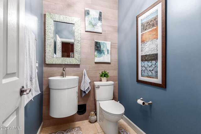 bathroom featuring vanity, toilet, and tile patterned floors