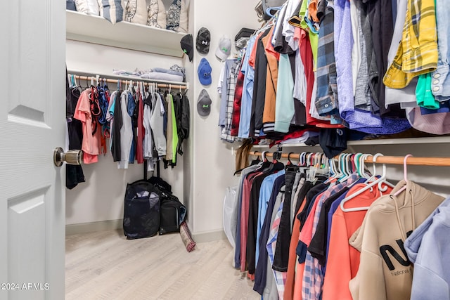 spacious closet featuring light hardwood / wood-style floors