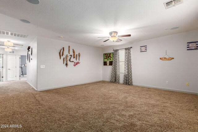 carpeted empty room with ceiling fan