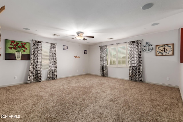 carpeted empty room with ceiling fan