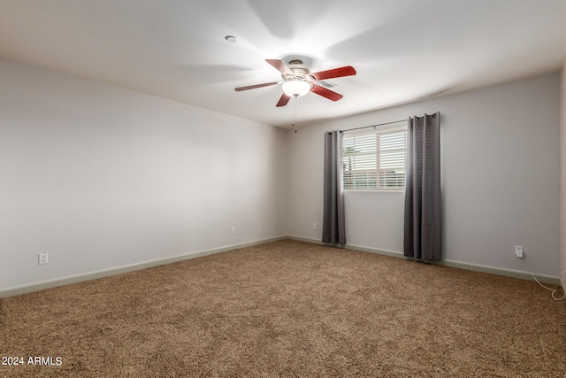 spare room with carpet flooring and ceiling fan