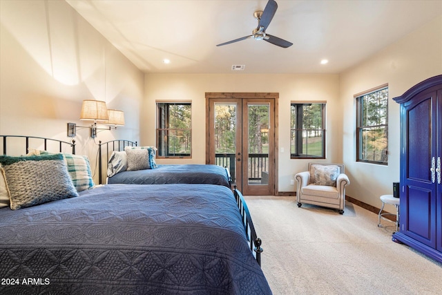 bedroom featuring ceiling fan, access to exterior, light colored carpet, and french doors