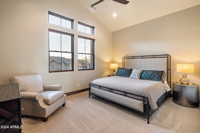 carpeted bedroom featuring ceiling fan and high vaulted ceiling