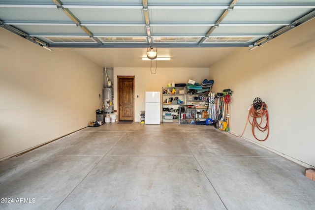 garage with white refrigerator, gas water heater, and a garage door opener