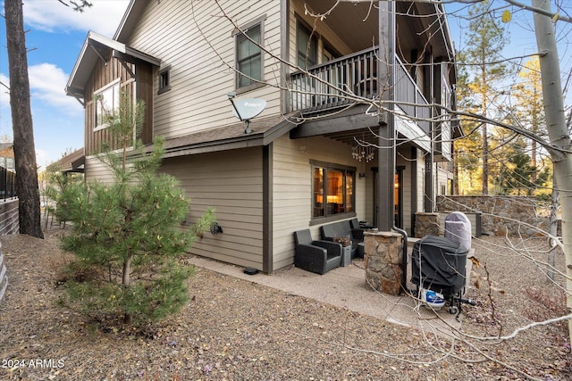 rear view of house with a balcony