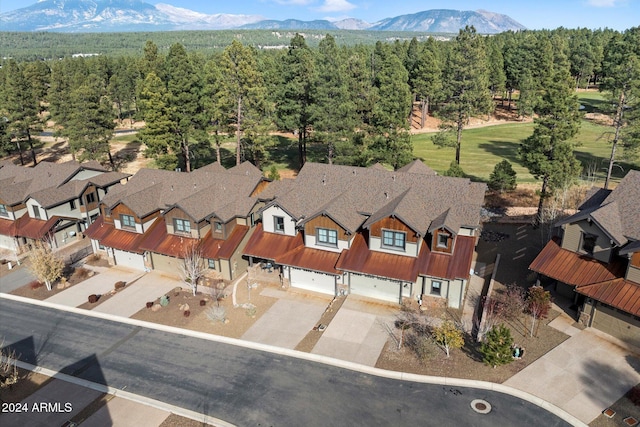 4320 W Arabian Trl, Flagstaff, AZ 86005 - aerial view of residential area with a mountain backdrop and a heavily wooded area