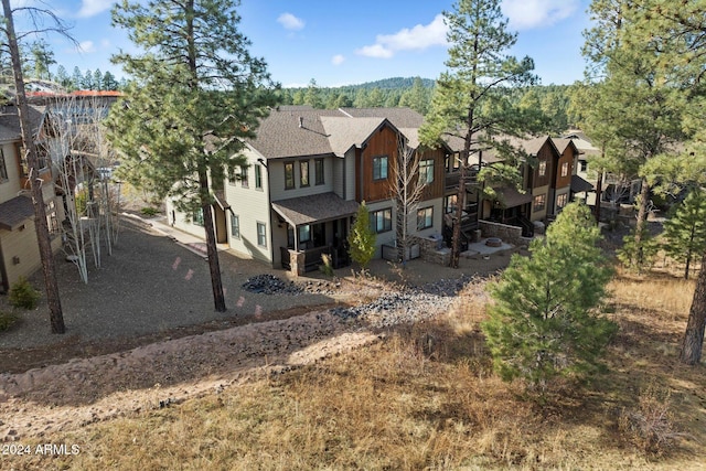 4320 W Arabian Trl, Flagstaff, AZ 86005 - rear view of property featuring board and batten siding and a shingled roof