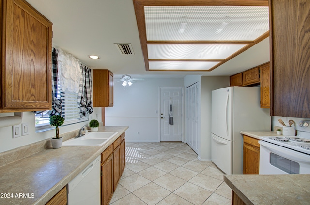 kitchen featuring ceiling fan, sink, light tile patterned floors, and white appliances