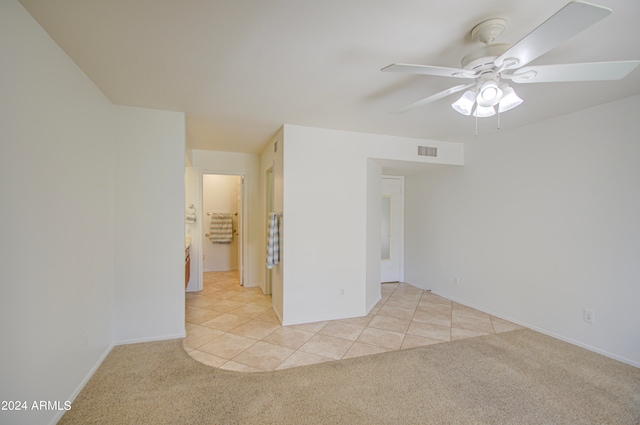 empty room with light carpet and ceiling fan