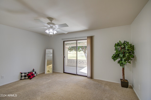 spare room featuring carpet flooring and ceiling fan