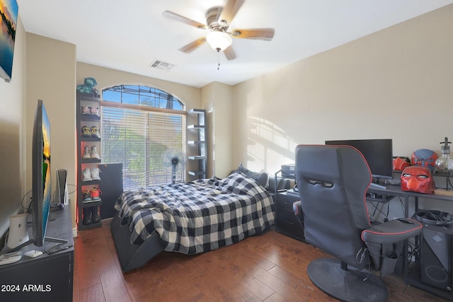 bedroom featuring dark hardwood / wood-style flooring and ceiling fan