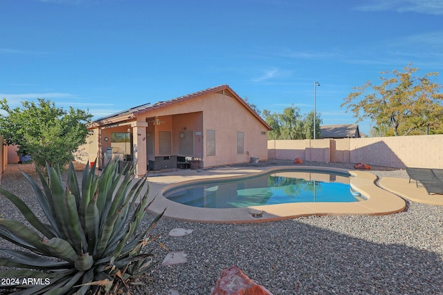 view of swimming pool featuring a patio area