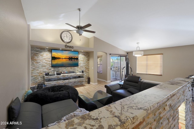 living room with ceiling fan, light hardwood / wood-style flooring, and high vaulted ceiling