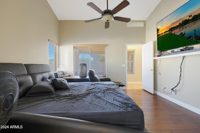 bedroom featuring hardwood / wood-style flooring, ceiling fan, and lofted ceiling