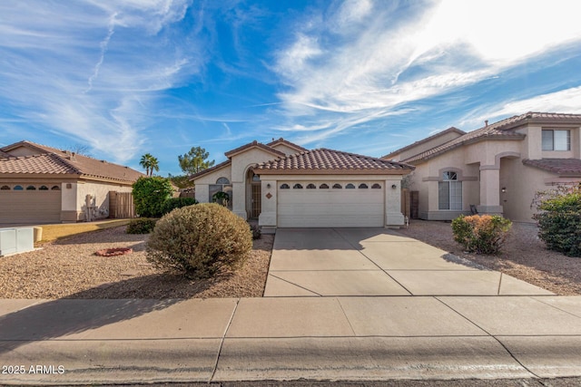 mediterranean / spanish-style house featuring a garage