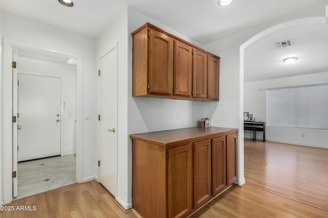 hall with light hardwood / wood-style floors