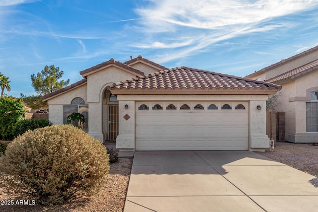 mediterranean / spanish house featuring a garage