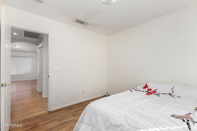 bedroom featuring wood-type flooring