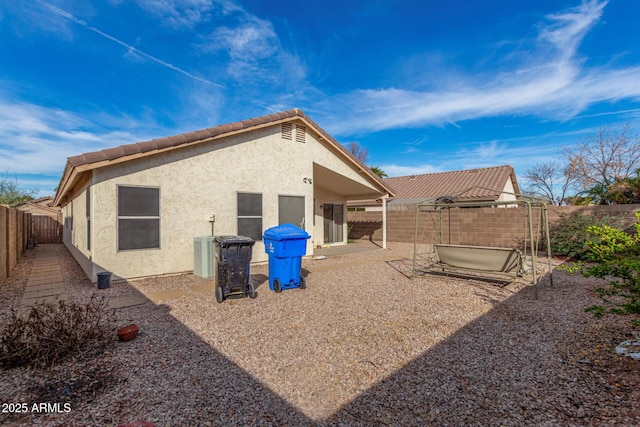 rear view of house with a patio