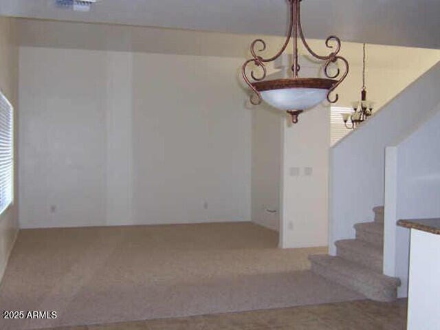 interior space featuring stairway and carpet flooring
