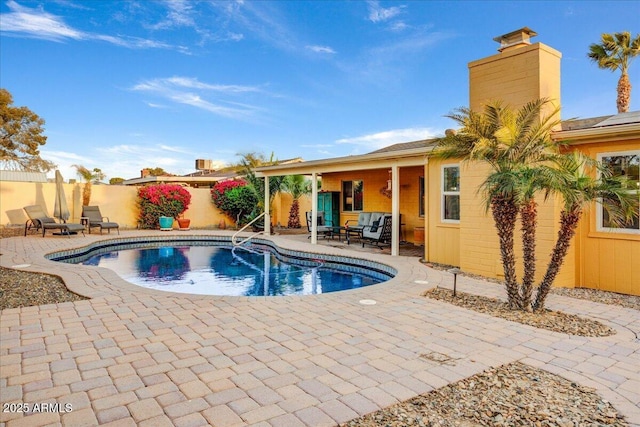 view of swimming pool featuring a patio area, a fenced backyard, and a fenced in pool