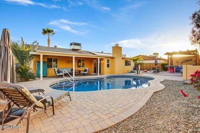 view of pool featuring a patio, an outdoor living space, a fenced in pool, and central air condition unit