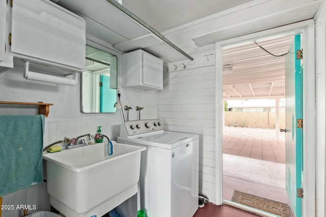 laundry area featuring washer / dryer and cabinet space