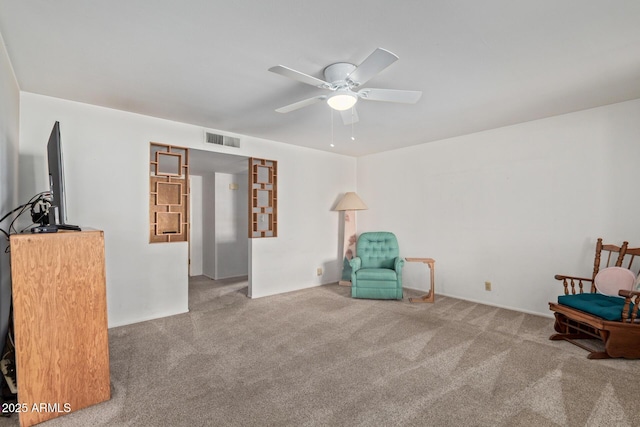 unfurnished room featuring carpet flooring and a ceiling fan
