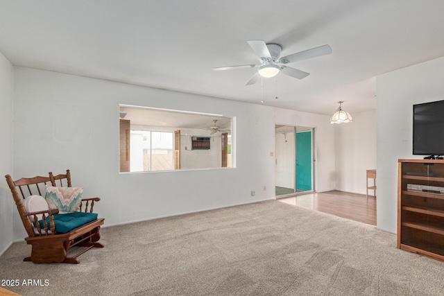 unfurnished room with carpet floors and ceiling fan