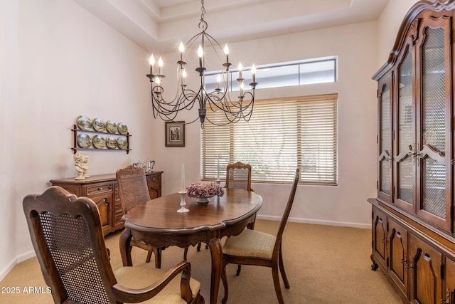 23760 N 80th Way, Scottsdale, AZ 85255 - dining area featuring a chandelier, light carpet, and baseboards